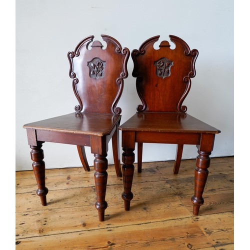 78 - A PAIR OF VICTORIAN MAHOGANY HALL CHAIRS AND A PIANO STOOL, the chairs measuring 88 x 44cms