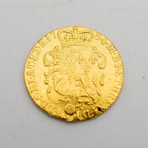 498 - A GEORGIAN GOLD GUINEA, DATED 1784