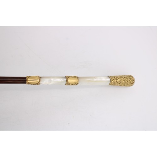 454 - A 19th WALKING CANE WITH A MOTHER OF PEARL AND YELLOW METAL HANDLE, the yellow metal banding and han... 