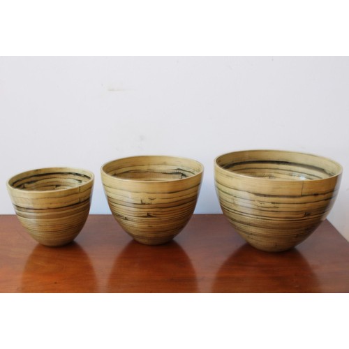 115 - A SET OF THREE CONTEMPORARY GRADUATED LACQUERED BAMBOO PLANTERS, the largest 20cm high x 28cm dia