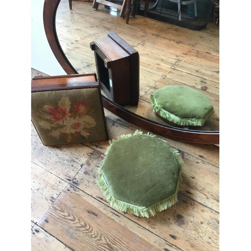 25 - A MAHOGANY OVAL FRAMED WALL MIRROR AND TWO VICTORIAN UPHOLSTERED FOOT STOOLS, the mirror 97 x 60cms