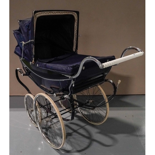 6 - A WILSON 'COACH BUILT' PRAM WITH DARK BLUE LIVERY, curved coach springs and pull-over fabric hood an... 