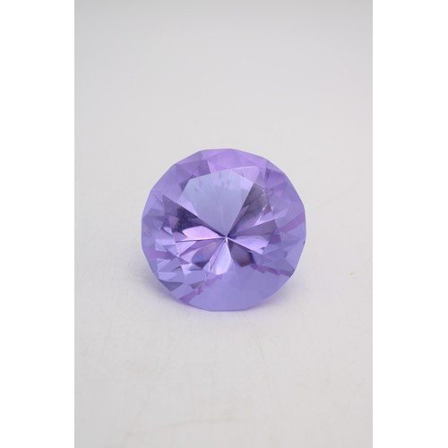 243 - A ROSENTHAL AMETHYST COLOURED GLASS 'PRINCESS CUT' PAPER WEIGHT, the Rosenthal mark etched onto base