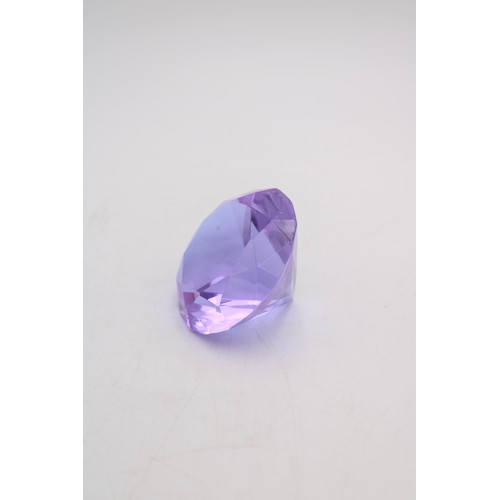 243 - A ROSENTHAL AMETHYST COLOURED GLASS 'PRINCESS CUT' PAPER WEIGHT, the Rosenthal mark etched onto base