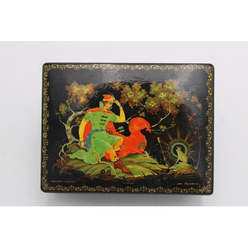 258 - A USSR 20th CENTURY HAND PAINTED PAPIER MACHE LAQUERED TRINKET BOX, decorated with folk lore scene, ... 