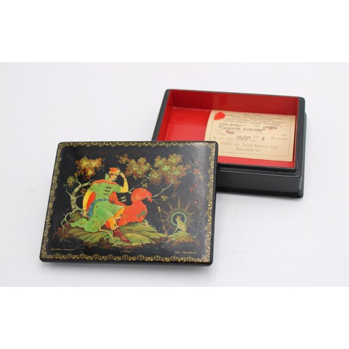 258 - A USSR 20th CENTURY HAND PAINTED PAPIER MACHE LAQUERED TRINKET BOX, decorated with folk lore scene, ... 