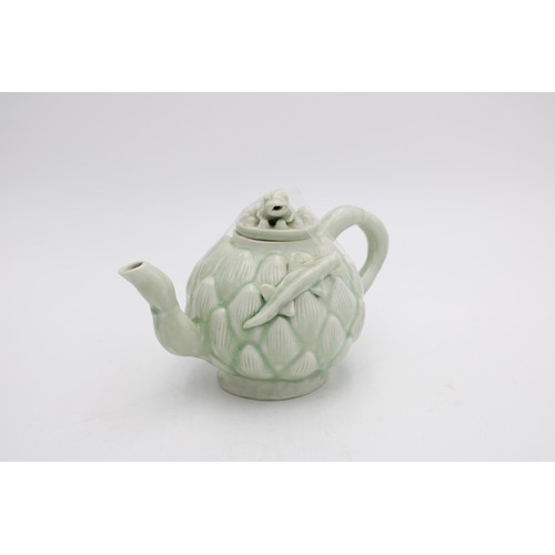 262 - A CELADON GLAZE LOTUS TEAPOT WITH FROG AND NEWT DECORATION, 14cm high