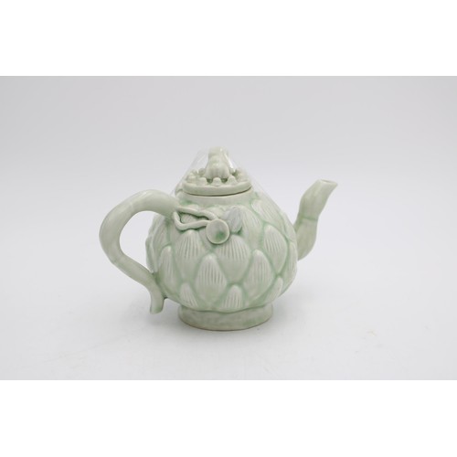 262 - A CELADON GLAZE LOTUS TEAPOT WITH FROG AND NEWT DECORATION, 14cm high