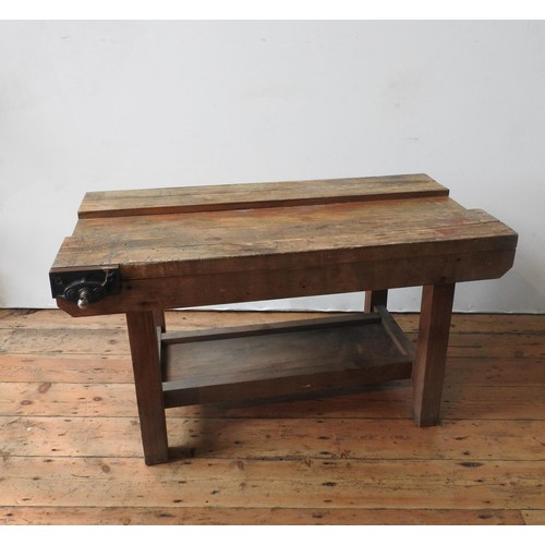 14 - A VINTAGE WORKSHOP BENCH, on a pine base with shelf below and bench vice attached, 66 x 122 x 62cm