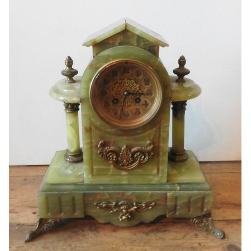 239 - A VICTORIAN ONYX BRASS MOUNTED MANTEL CLOCK, with twin pillars on brass scroll feet, 37 x 36 cm