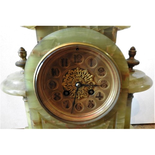 239 - A VICTORIAN ONYX BRASS MOUNTED MANTEL CLOCK, with twin pillars on brass scroll feet, 37 x 36 cm