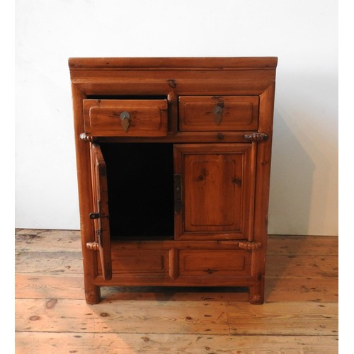 21 - AN ORIENTAL STYLE HARDWOOD TWO DOOR CUPBOARD, with two drawers, 86 x 64 x 50cm