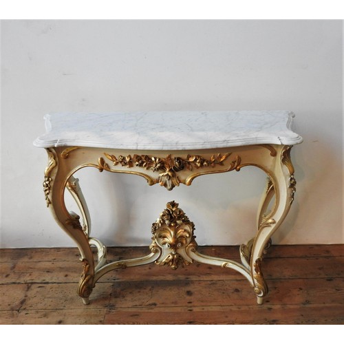 22 - A 19TH CENTURY MARBLE TOP ROCOCO STYLE CONSOLE TABLE, the bevelled marble top sitting on a cream pai... 