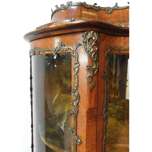 26 - A 20TH CENTURY LOUIS XV STYLE WALNUT VENEER MARQUETRY INLAID VETRINE CABINET, with glazed serpentine... 