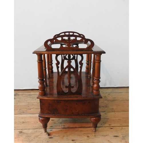 31 - A BRIGHTS OF NETTLEBED BURR WALNUT CANTERBURY, with a single drawer, spindle supports and ornate fre... 