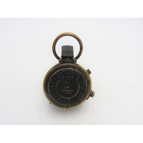 236 - A BRASS FIRST WORLD WAR COMPASS, inscribed on the reverse F-L, No.121057, 1918, 5 cm dia