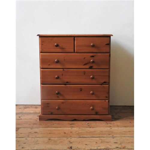 55 - A PINE PANELLED WARDROBE, A PINE WARDROBE WITH TOP LOCKER A ND A PINE CHEST OF SIX DRAWERS, and a pa... 