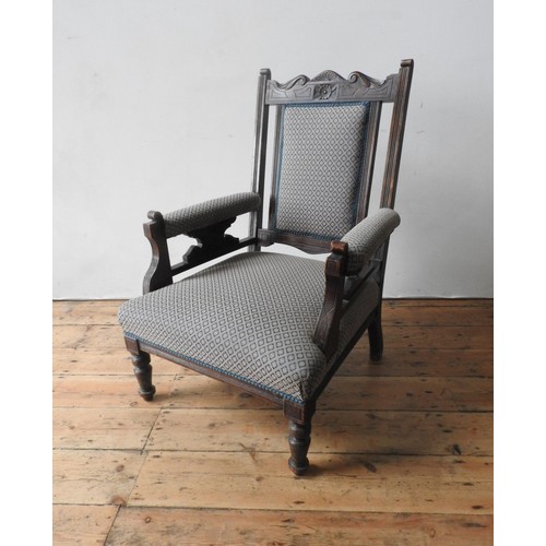 61 - A VICTORIAN MAHOGANY NURSING CHAIR ON TURNED LEGS, with upholstered seat, back panel and arm rests, ... 