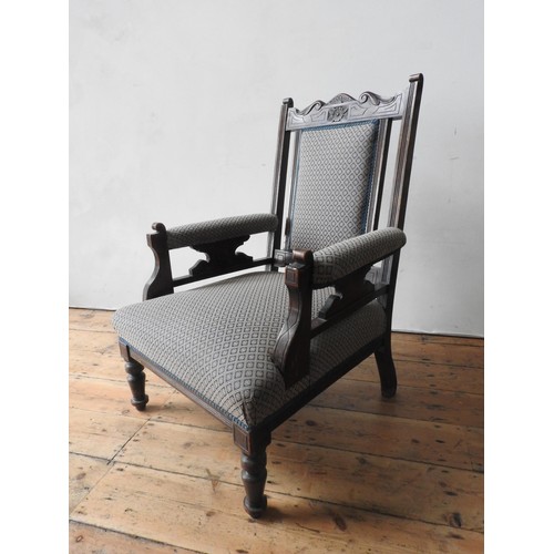 61 - A VICTORIAN MAHOGANY NURSING CHAIR ON TURNED LEGS, with upholstered seat, back panel and arm rests, ... 