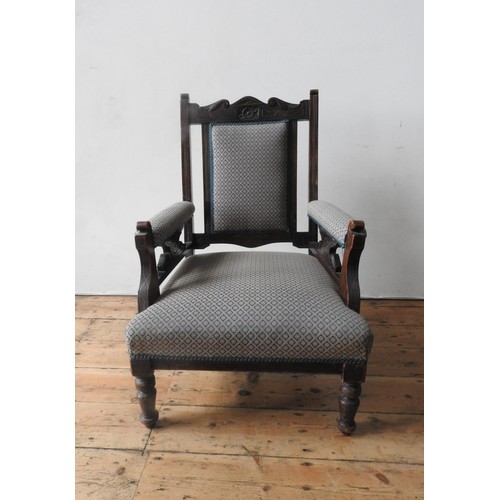 61 - A VICTORIAN MAHOGANY NURSING CHAIR ON TURNED LEGS, with upholstered seat, back panel and arm rests, ... 