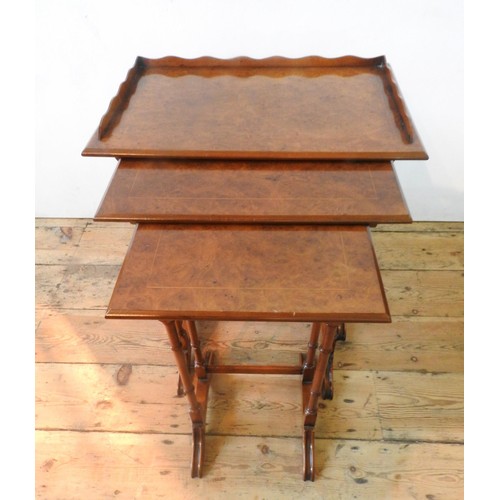 63 - A BRIGHTS OF NETTLEBED NEST OF THREE BURR WALNUT TABLES, all with turned spindle legs, the largest w... 