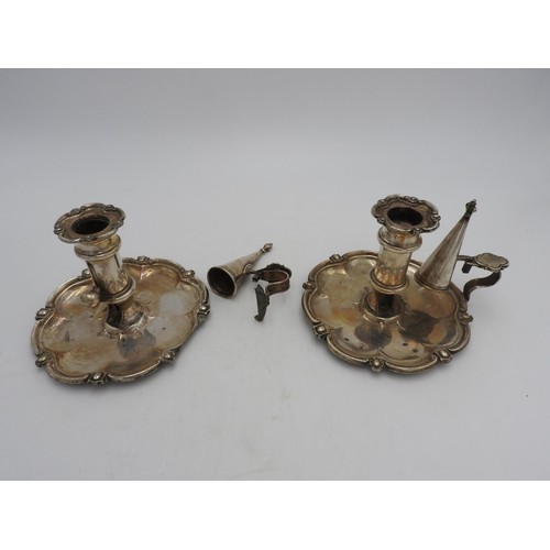 322 - A PAIR OF SILVER PLATED ADJUSTABLE CHAMBER STICKS WITH CANDLE SNUFFERS, the bases in a tudor rose fo... 