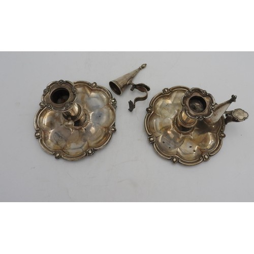 322 - A PAIR OF SILVER PLATED ADJUSTABLE CHAMBER STICKS WITH CANDLE SNUFFERS, the bases in a tudor rose fo... 