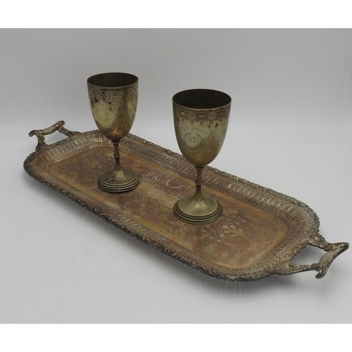 323 - A LONG TWO HANDLED PLATED TRAY AND TWO VICTORIAN PRESENTATION GOBLETS, the tray with pierced fret wo... 