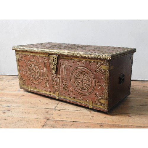 64 - A MIDDLE EASTERN BRASS STUDDED BLANKET CHEST, with moon and star decoration, with two handles 47 x 9... 