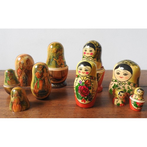 277 - TWO SETS OF STACKING GRADUATED RUSSIAN DOLLS, ten dolls in each set, one set in traditional doll des... 