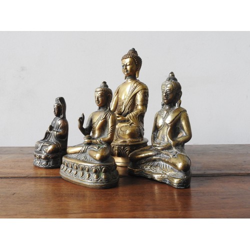 216 - FOUR CAST BRONZE SEATED BUDDHA FIGURES, 20 cm high and three smaller