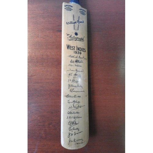 298 - TWO SIGNED MINIATURE CRICKET BATS, the larger bat bearing the signature of Don Bradman amongst other... 