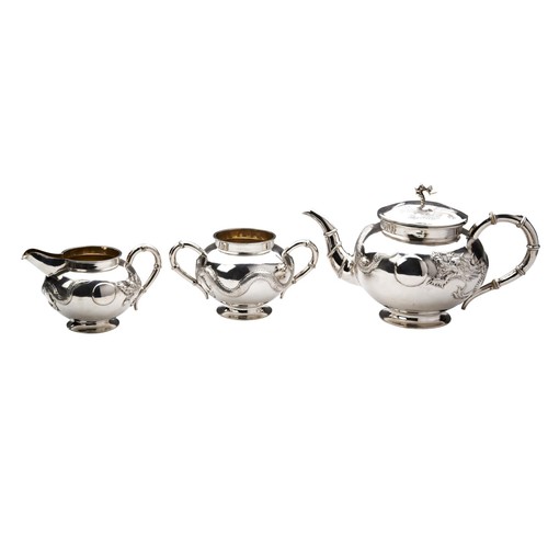 204 - CHINESE SILVER THREE PIECE TEA SETTSUN TSUN, LATE QING DYNASTYof globular form the sides with simula... 