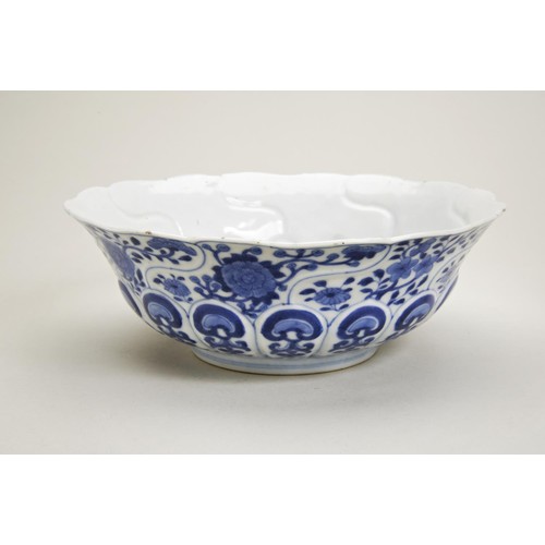 34 - BLUE AND WHITE MOULDED 'LOTUS' BOWLJIAQING SEAL MARK AND OF THE PERIODthe moulded sides painted in t... 