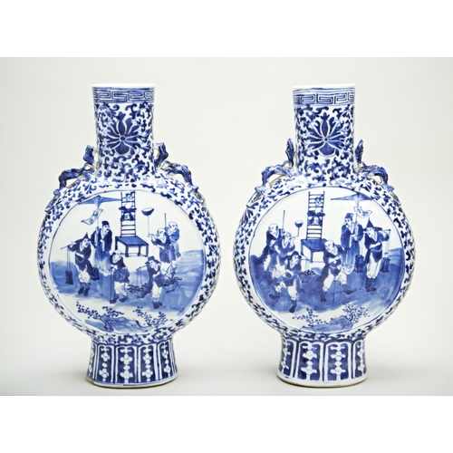 35 - PAIR OF BLUE AND WHITE MOONFLASKSQING DYNASTY, 19TH CENTURYthe flattened ovoid sides painted in tome... 