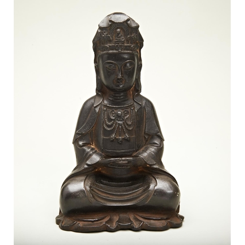 8 - CAST IRON FIGURE OF SEATED GUANYINMING DYNASTY (1368-1644)seated in dhyanasana, shown in a long flow... 