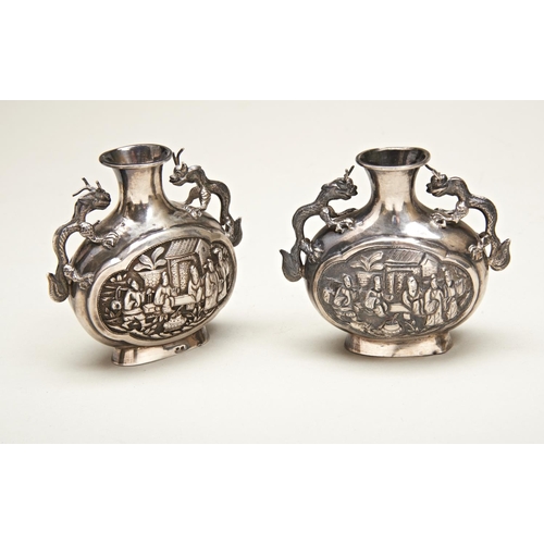 211 - PAIR OF SMALL CHINESE SILVER EXPORT VASESWANG HING, HONG KONG, LATE 19TH CENTURYthe compressed balus... 