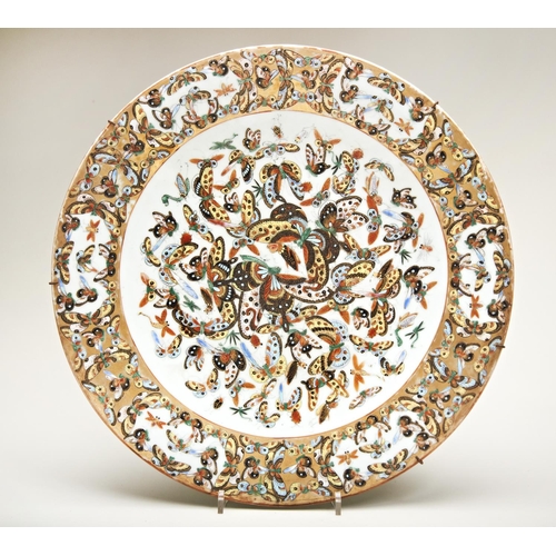 84 - FAMILLE ROSE '100-BUTTERFLIES' CELADON GROUND CHARGERQING DYNASTY, 19TH CENTURYpainted throughout in... 