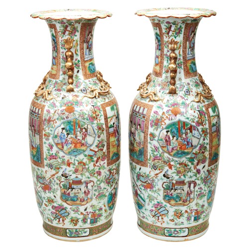 85 - LARGE PAIR OF FAMILLE ROSE CANTON VASESQING DYNASTY, 19TH CENTURYthe baluster sides painted with pan... 