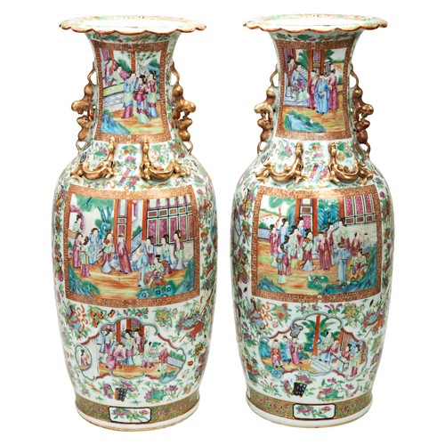 85 - LARGE PAIR OF FAMILLE ROSE CANTON VASESQING DYNASTY, 19TH CENTURYthe baluster sides painted with pan... 