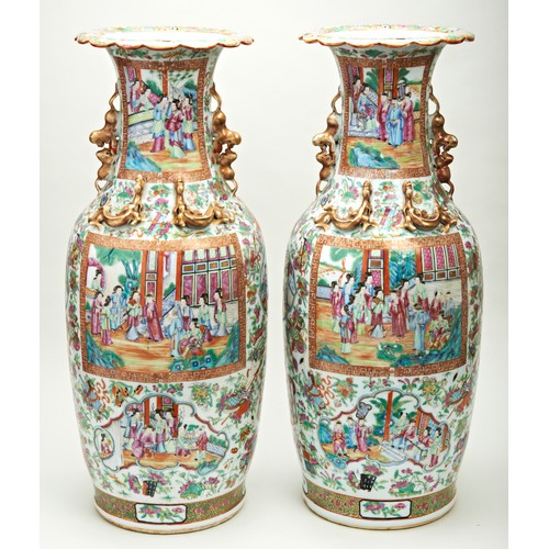 85 - LARGE PAIR OF FAMILLE ROSE CANTON VASESQING DYNASTY, 19TH CENTURYthe baluster sides painted with pan... 