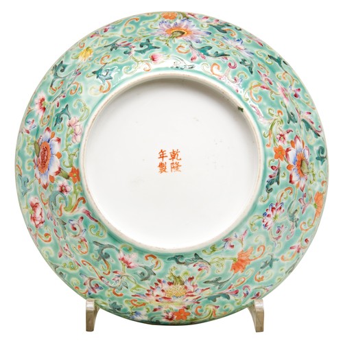 92 - FAMILLE ROSE GREEN-GROUND 'LOTUS' BOWLQING DYNASTY, 19TH CENTURYthe sides painted with lotus blooms ... 