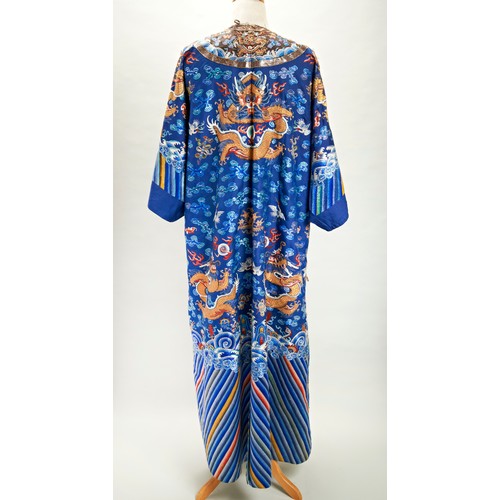 239 - EMBROIDERED BLUE-GROUND 'DRAGON' ROBE, MANGPAOQING DYNASTY, 19TH CENTURYwith alterations, worked in ... 