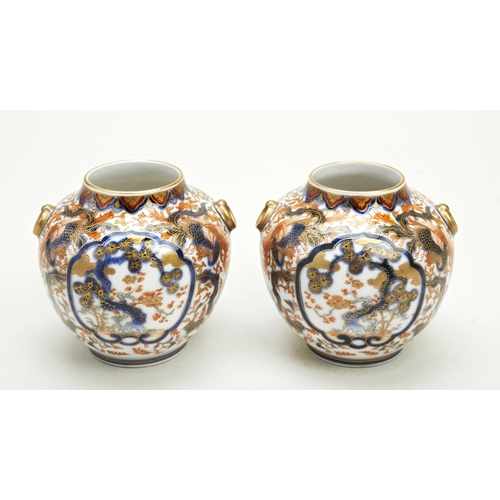 285 - PAIR OF SMALL IMARI VASESFUKAGAWA, MEIJI PERIOD (1868-1912)the globular sides with twin loop handles... 