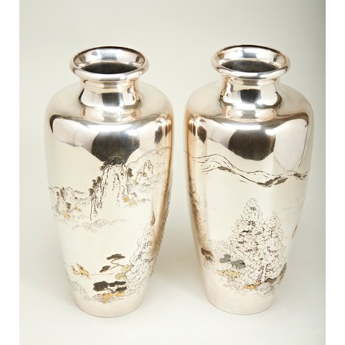 322 - PAIR OF JAPANESE SILVER VASESMEIJI PERIOD (1868-1912)the baluster sides decorated in low relief with... 