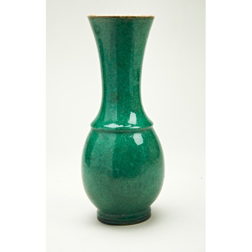 69 - APPLE-GREEN GLAZE TRUMPET VASELATE QING DYNASTYthe sides covered in a fine crackle green-glaze, dril... 