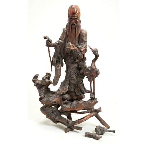 230 - CARVED ROOTWOOD FIGURE OF SHOULAOQING DYNASTY, 19TH CENTURYshown standing holing a staff and a peach... 