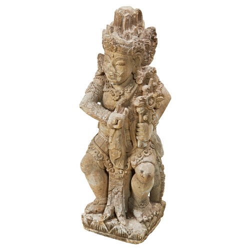 332 - LARGE CARVED LAVA-STONE FIGURE OF VISHNUINDIA, 19TH CENTURY shown seated wearing elaborate jewellery... 