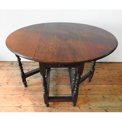 18 - AN OAK 19TH CENTURY TURNED LEG DROP-LEAF TABLE AND AN OAK BARLEY TWIST GATE-LEG TABLE, the larger dr... 