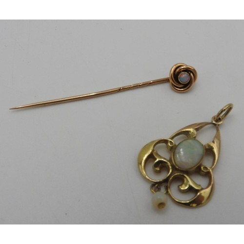 453 - A 9CT GOLD PENDANT SET WITH TWO OPALS AND A GOLD OPAL SET STICK PIN